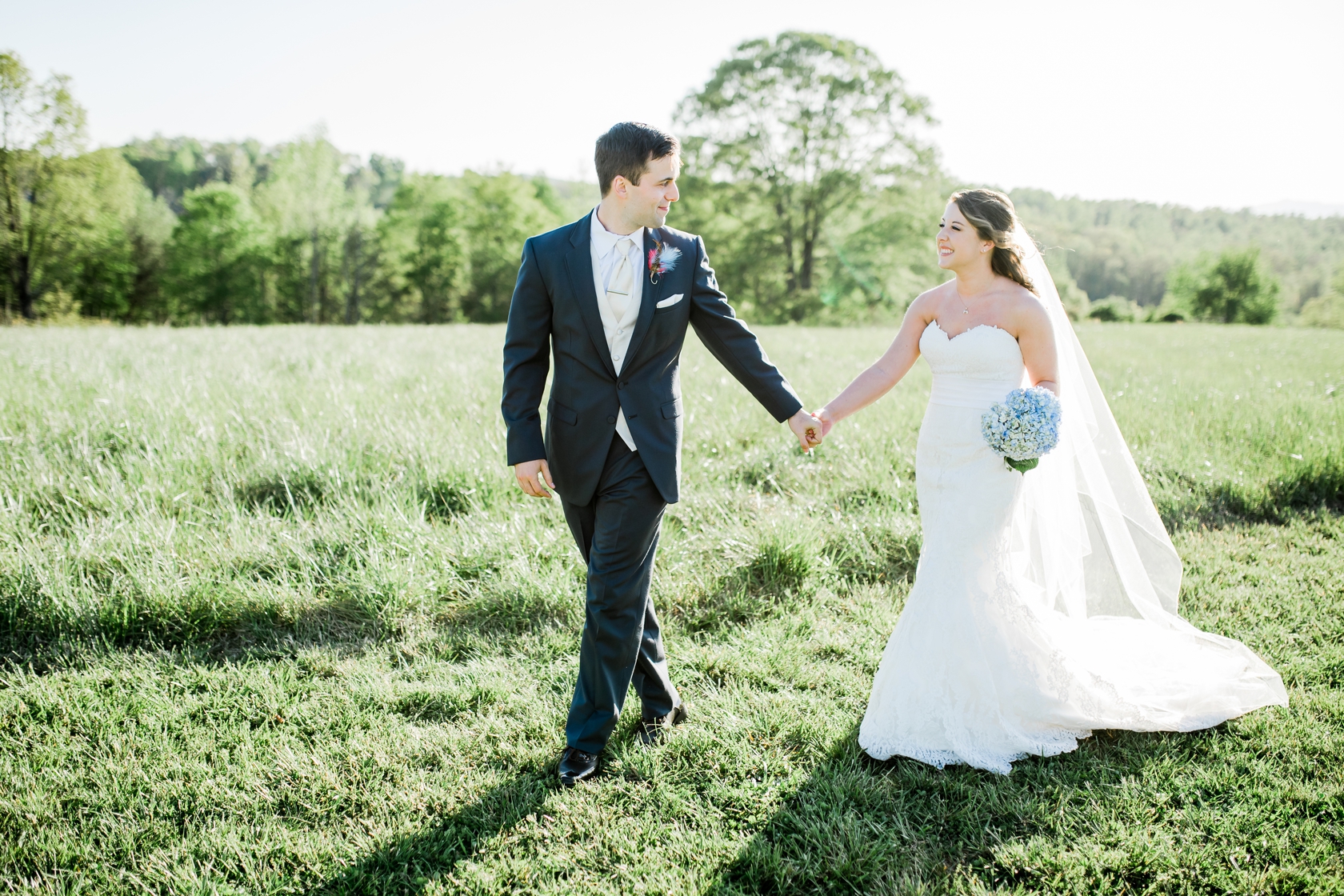 Bride and groom portraits poses in field at Lindsey Plantation