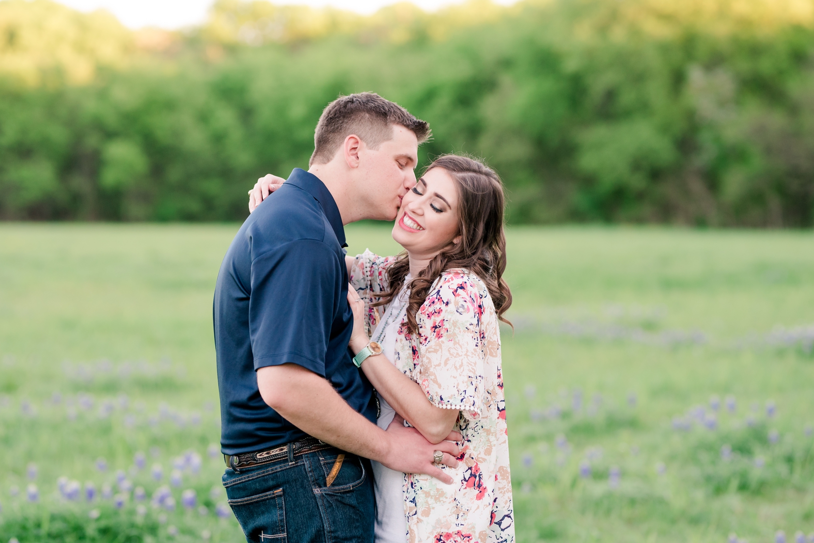 Groom kissing bride on the cheek in a Penn Farms engagement session